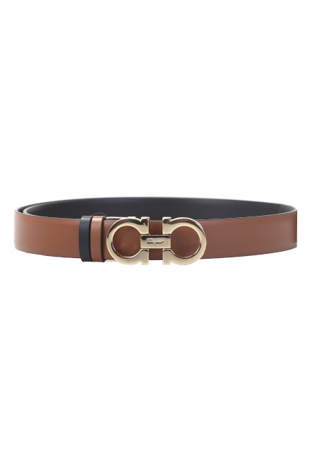 Shop SALVATORE FERRAGAMO  Cintura: Salvatore Ferragamo cintura reversibile e regolabile Gancini.
Asta in vitello martellato.
Reversibile.
Bicolore.
Fibbia Gancini in finitura dorata.
Per ottenere la vestibilità desiderata, tagliare l'asta della cintura o aggiungere i fori necessari.
Altezza 2,5 cm.
Composizione: 100% pelle di vitello.
Fabbricato in Italia.. 23A565 H 25-527674487NERO/CUOIO